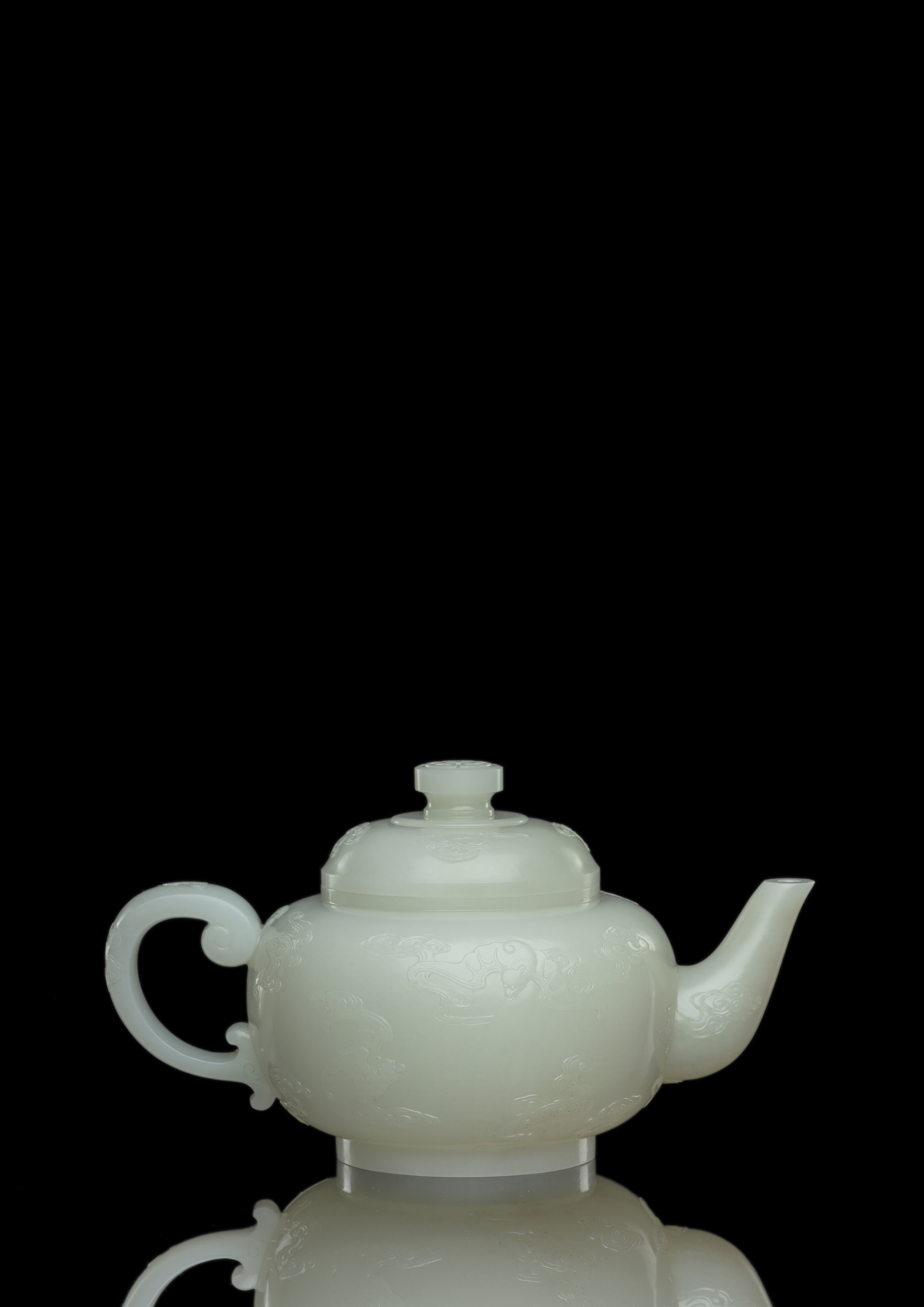 AN EXCEPTIONAL AND LARGE NEAR WHITE JADE TEAPOT AND COVER