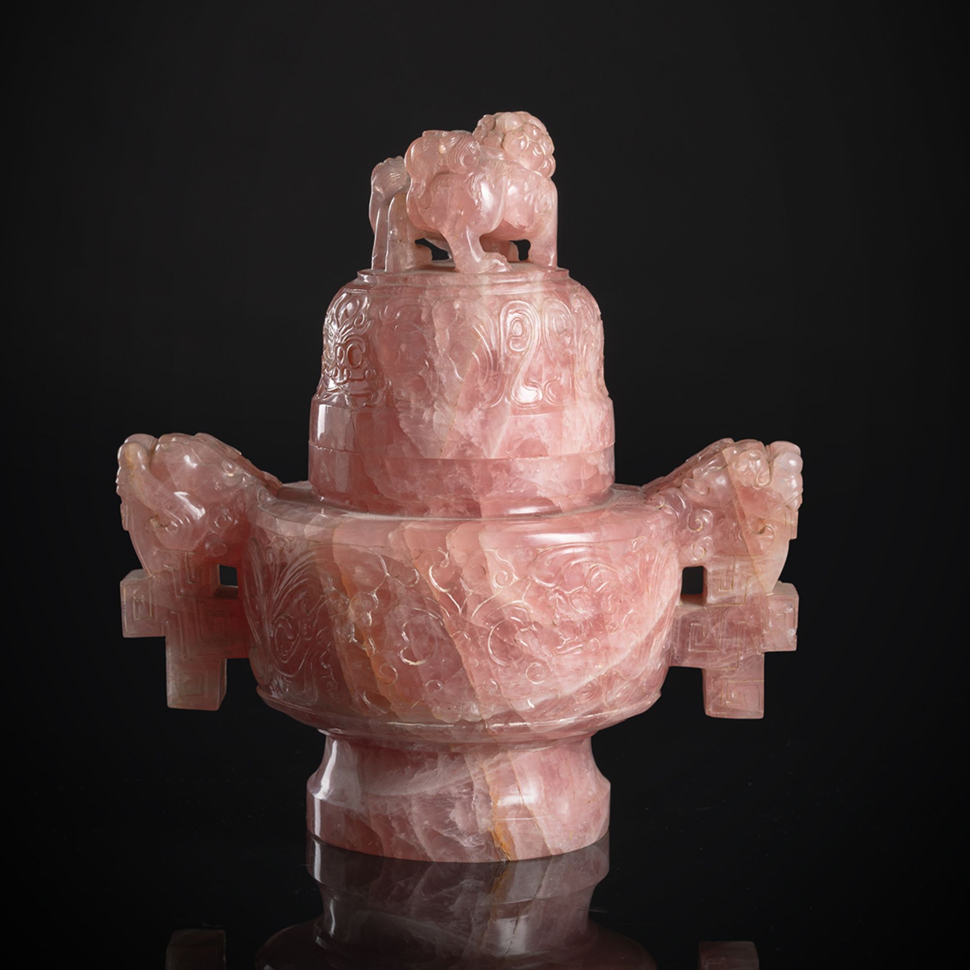 A WELL CARVED ROSE QUARTZ CENSER AND COVER ON WOOD STAND