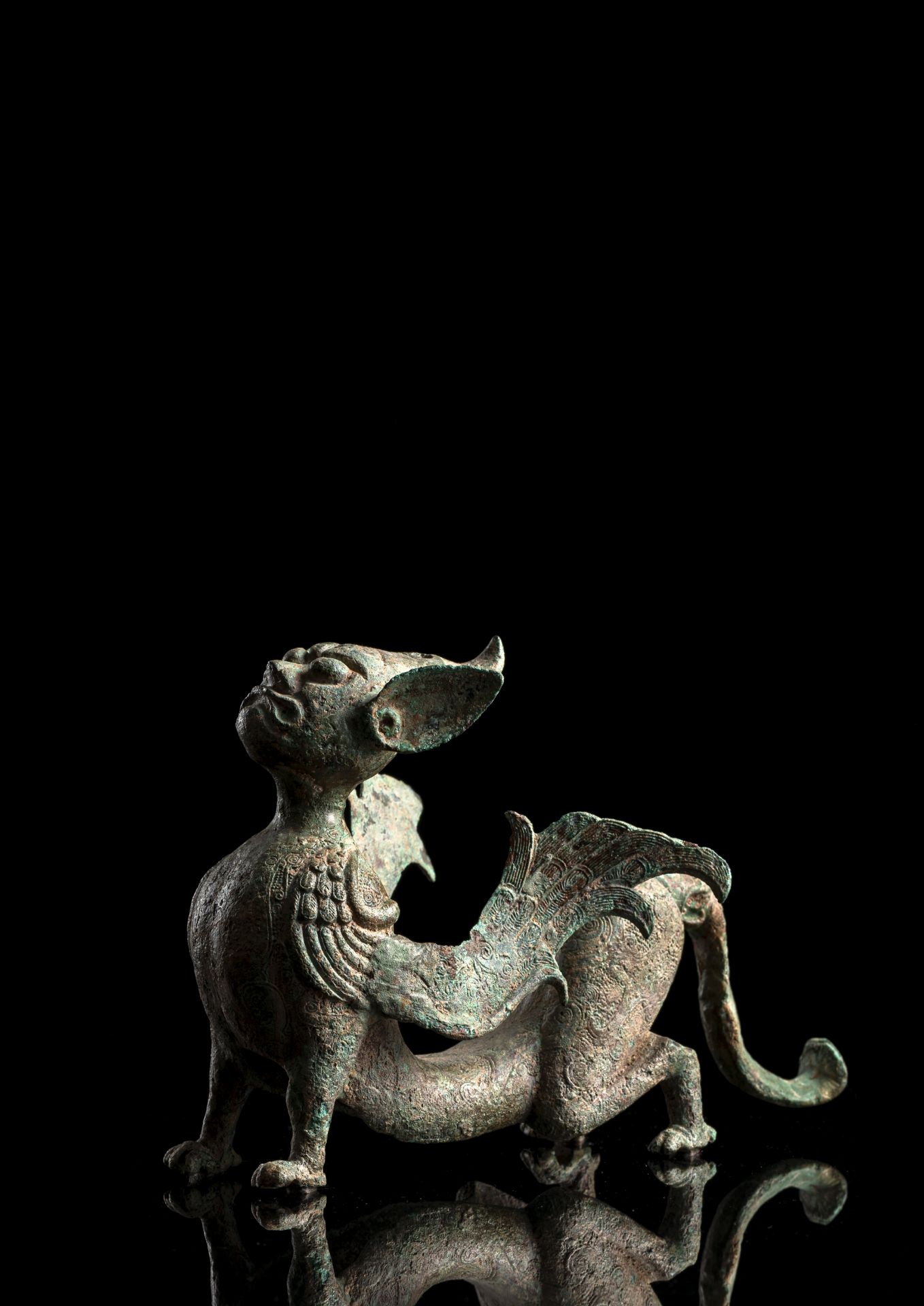 A BRONZE SCULPTURE OF AN EARTH SPIRIT OR CHIMERA