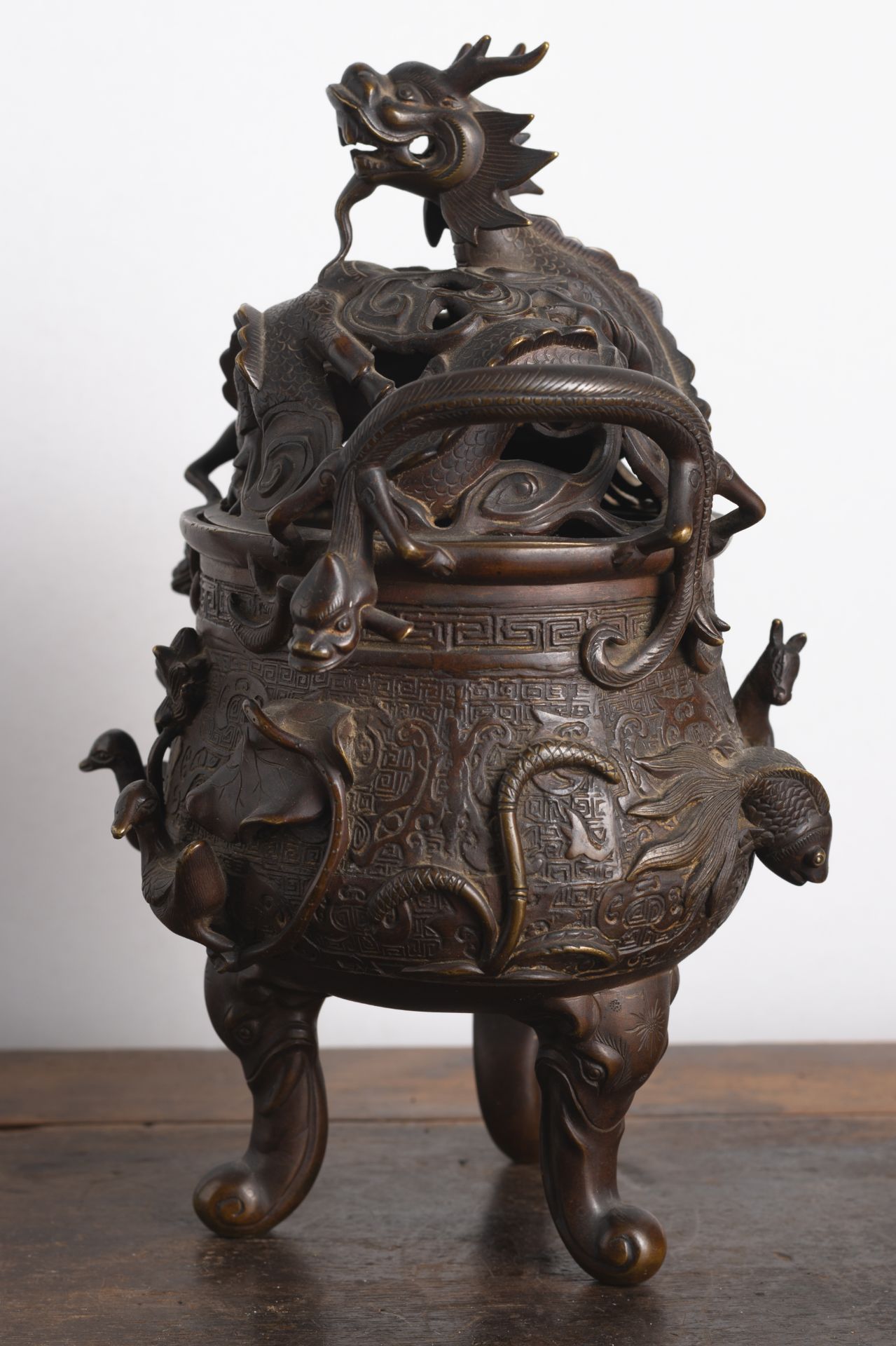 A GOOSE, HORSE, AND FISH RELIEF TRIPOD BRONZE CENSER AND OPENWORK DRAGON COVER - Image 4 of 6