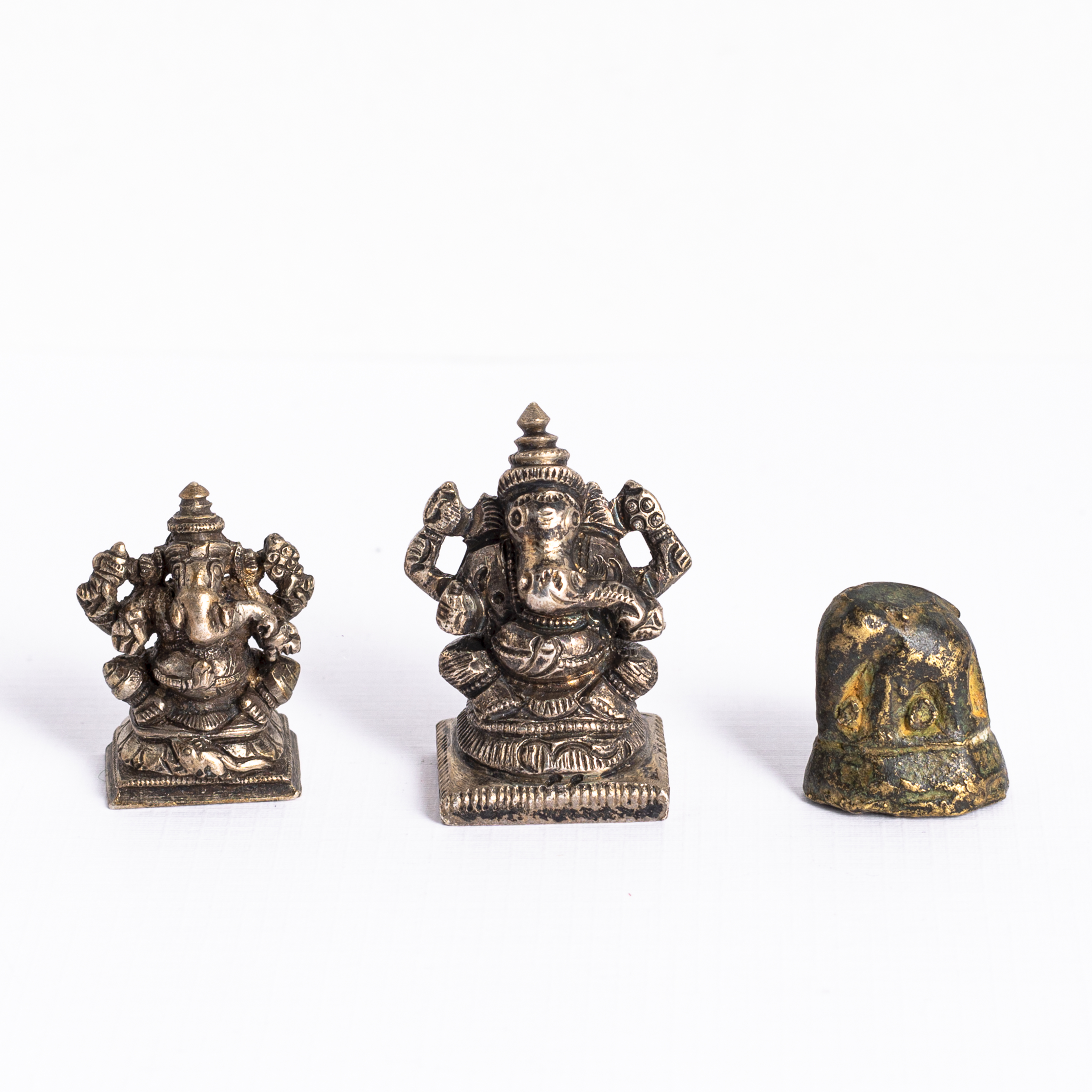 TWO LOW-ALLOY SILVER FIGURINES OF GANESHA AND A BRONZE ELEPHANT