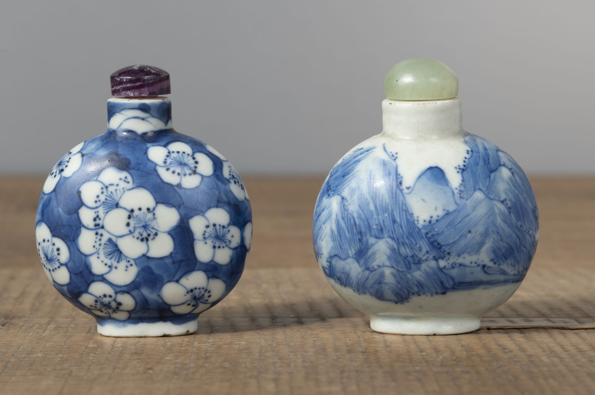 TWO BLUE AND WHITE PORCELAIN SNUFF BOTTLES DEPICTING PLUM BLOSSOMS AND A MOUNTAIN LANDSCAPE - Image 2 of 4