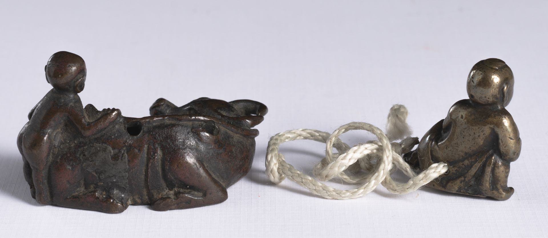 TWO SMALL BRONZES AS NETSUKE: A YOUNG BOY WITH BUFFALO AND A RESTING BOY - Image 2 of 3