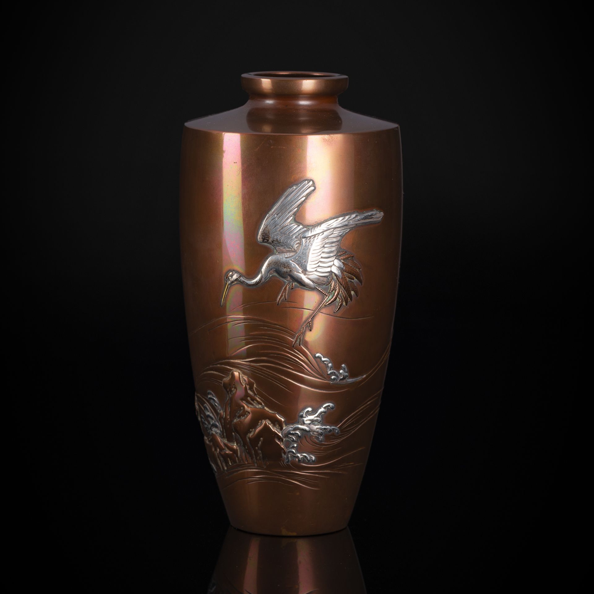 A COPPER VASE WITH CRANE IN SILVER TAKAZOGAN ABOVE WAVES AND ROCKS