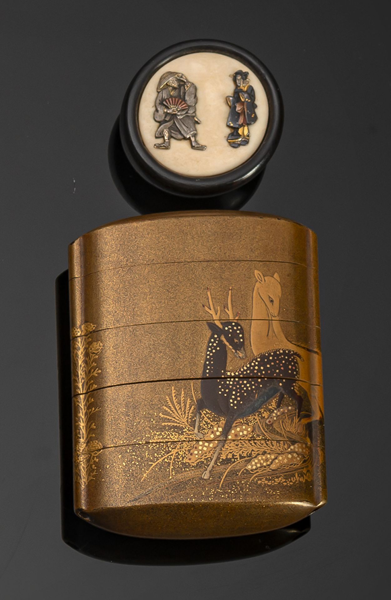 A FOUR-CASE LACQUER INRO WITH STAG AND DEERS, WOOD AND IVORY KAGAMIBUTA