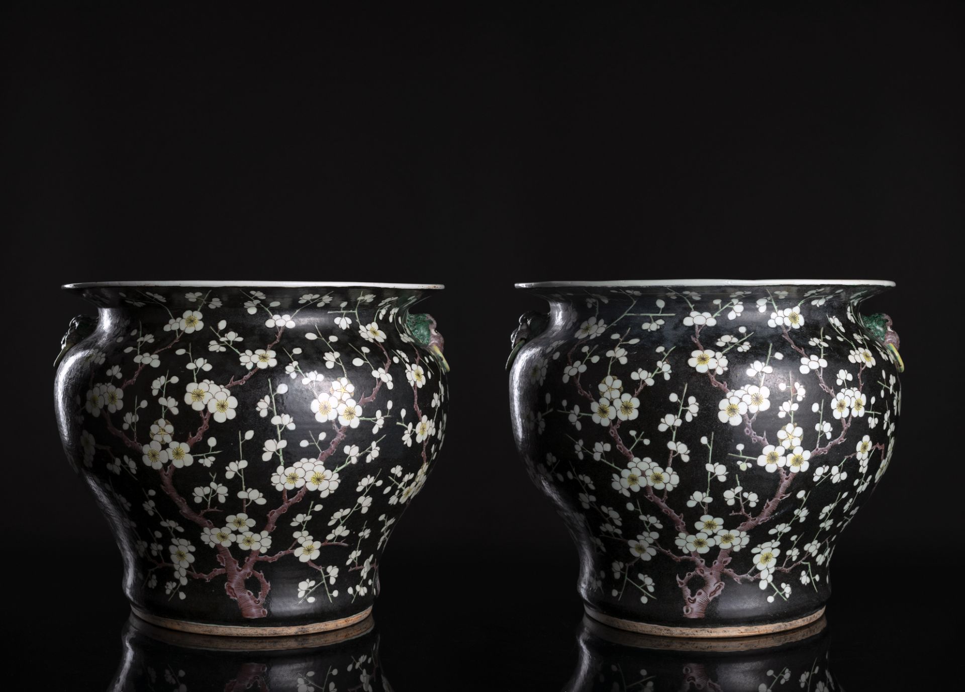 A LARGE PAIR OF BLACK-GROUND AND GOLD DECORATED PRUNUS CACHEPOTS WITH HANDLES