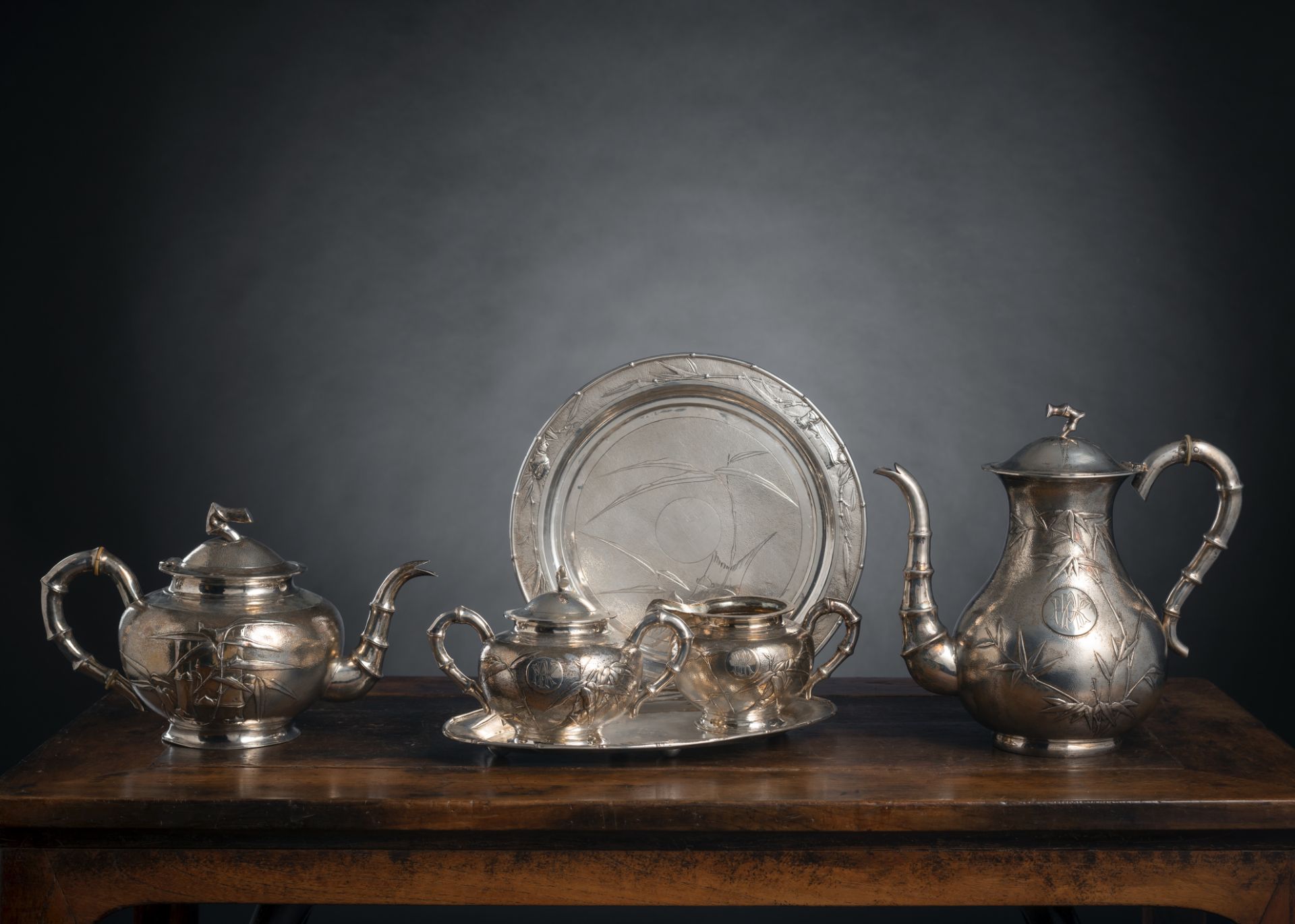 A SILVER SERVICE WITH TEA AND COFFEPOT, A MILK JUG AND A SUGAR BOX AND COVER WITH PLATE AND FURTHER