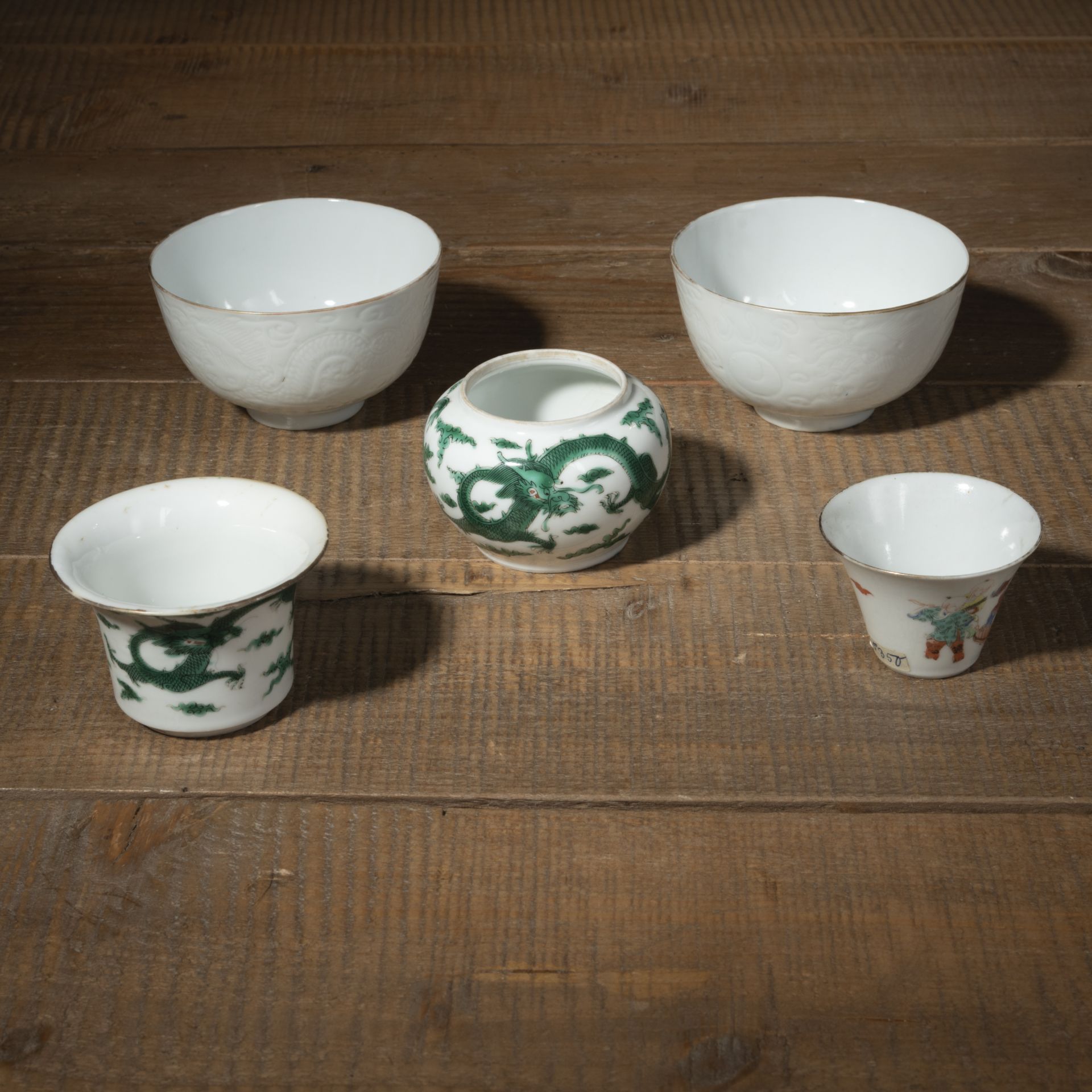 A PAIR OF DRAGON-INCISED PORCELAIN BOWLS, A TWO-PART SPITTOON, AND SMALL CUP