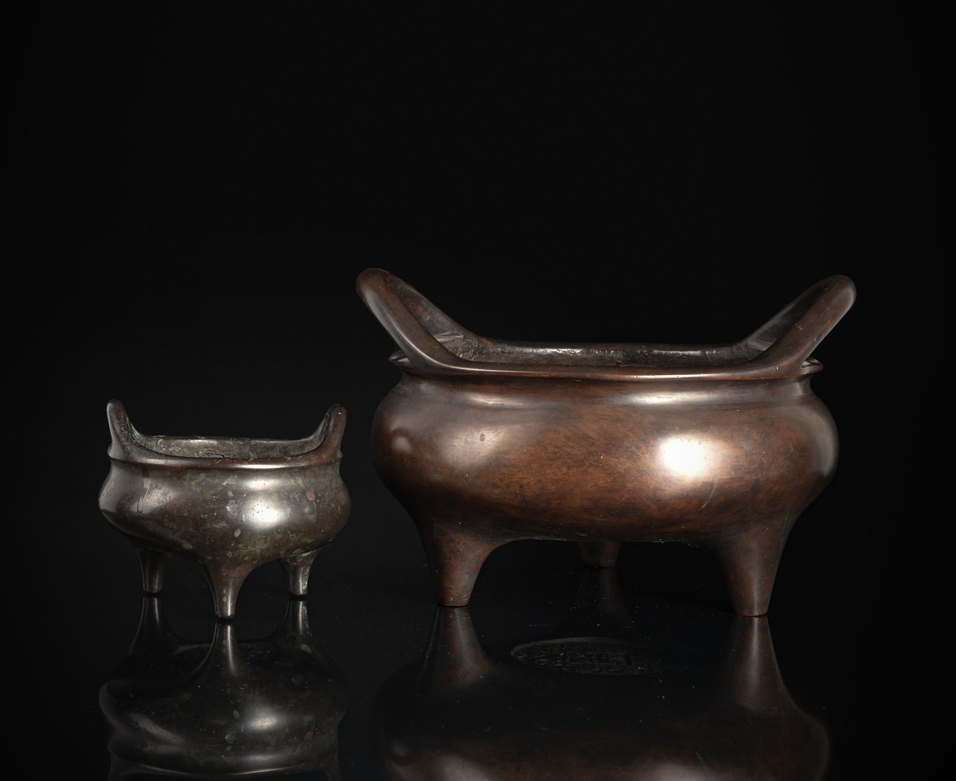 A HEAVY CAST BRONZE TRIPOD CENSER AND A SMALL BRONZE CENSER