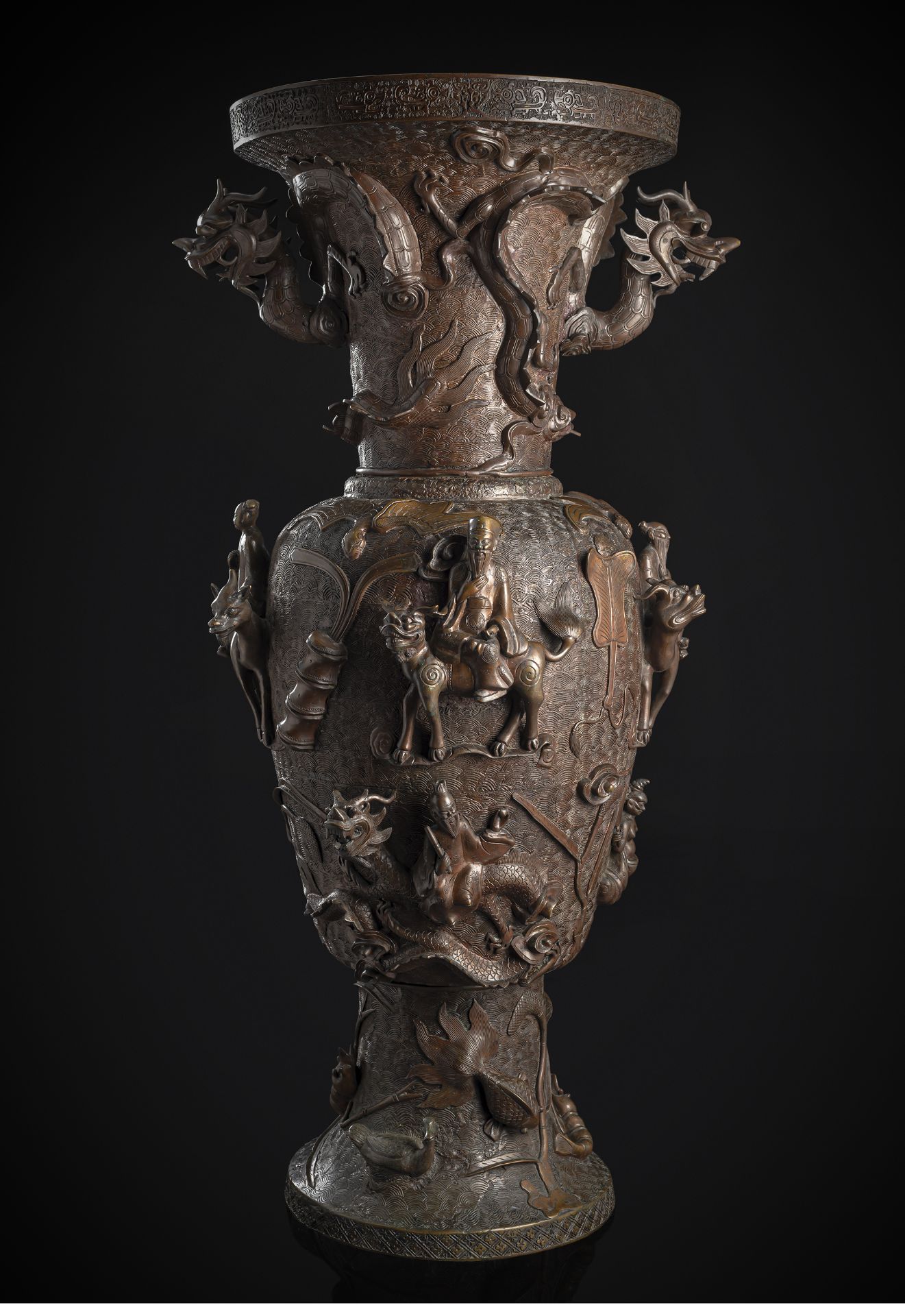 A LARGE WELL CAST BRONZE VASE WITH DAOIST IMMORTALS AND SEA ANIMALS IN HIGH RELIEF