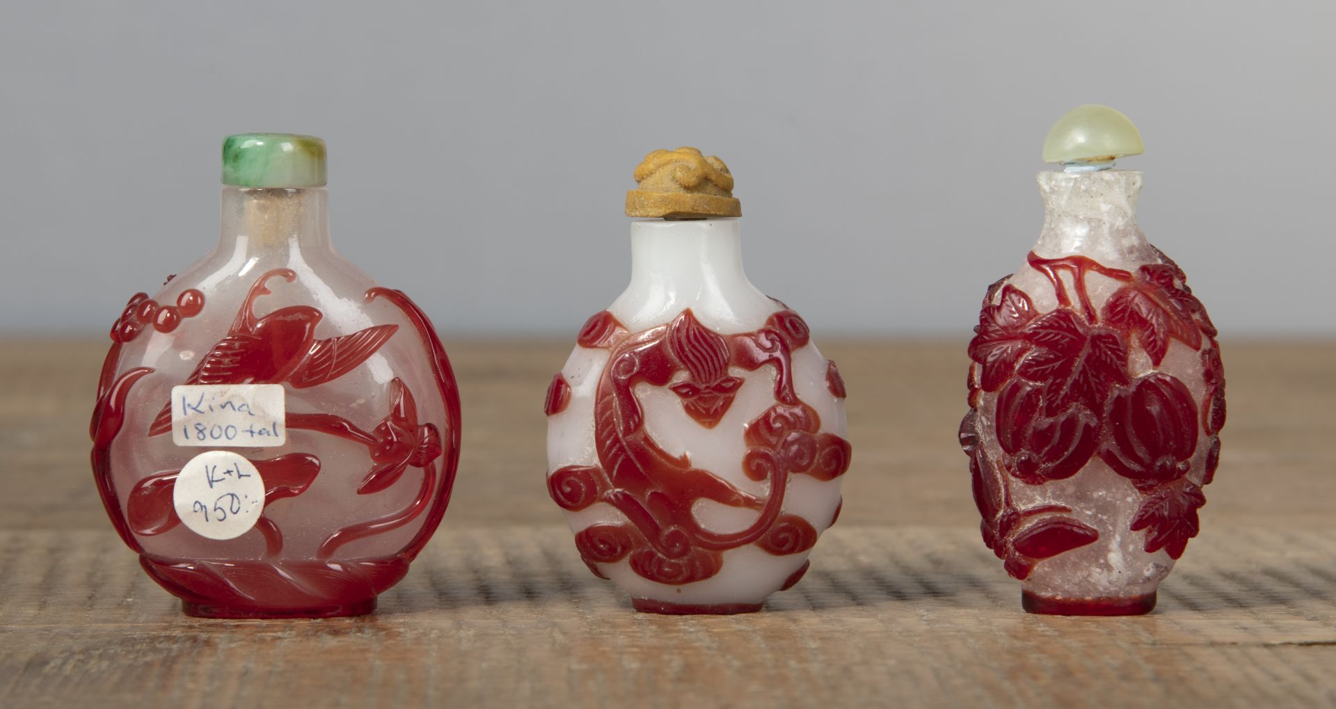 THREE PEKING GLASS SNUFF BOTTLES WITH RED OVERLAY DEPICTING WILD GEESE, CHILONG, PHOENIX AND MELON - Image 2 of 4