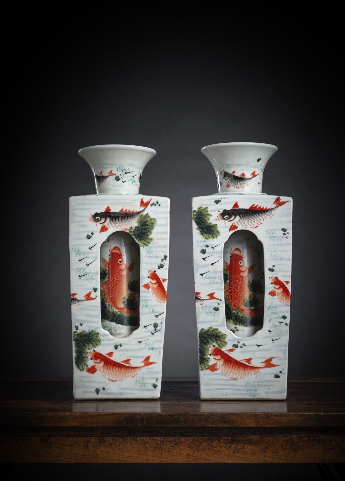 A PAIR OF POLYCHROME CARPS REVOLVING PORCELAIN VASES