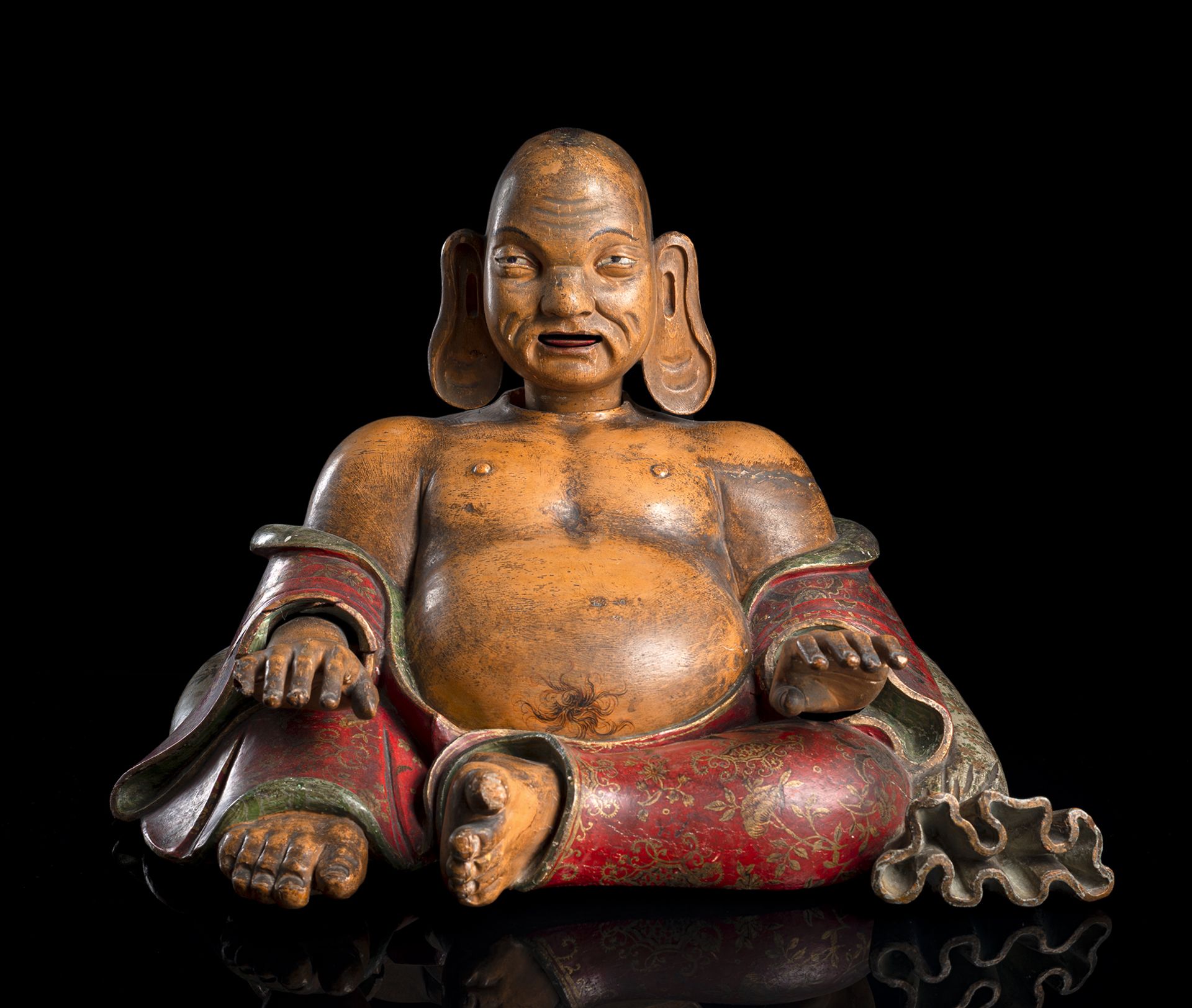 A PAINTED POTTERY AND WOOD FIGURE OF SEATED BUDAI WITH MOVABLE HEAD, TONGUE AND HANDS