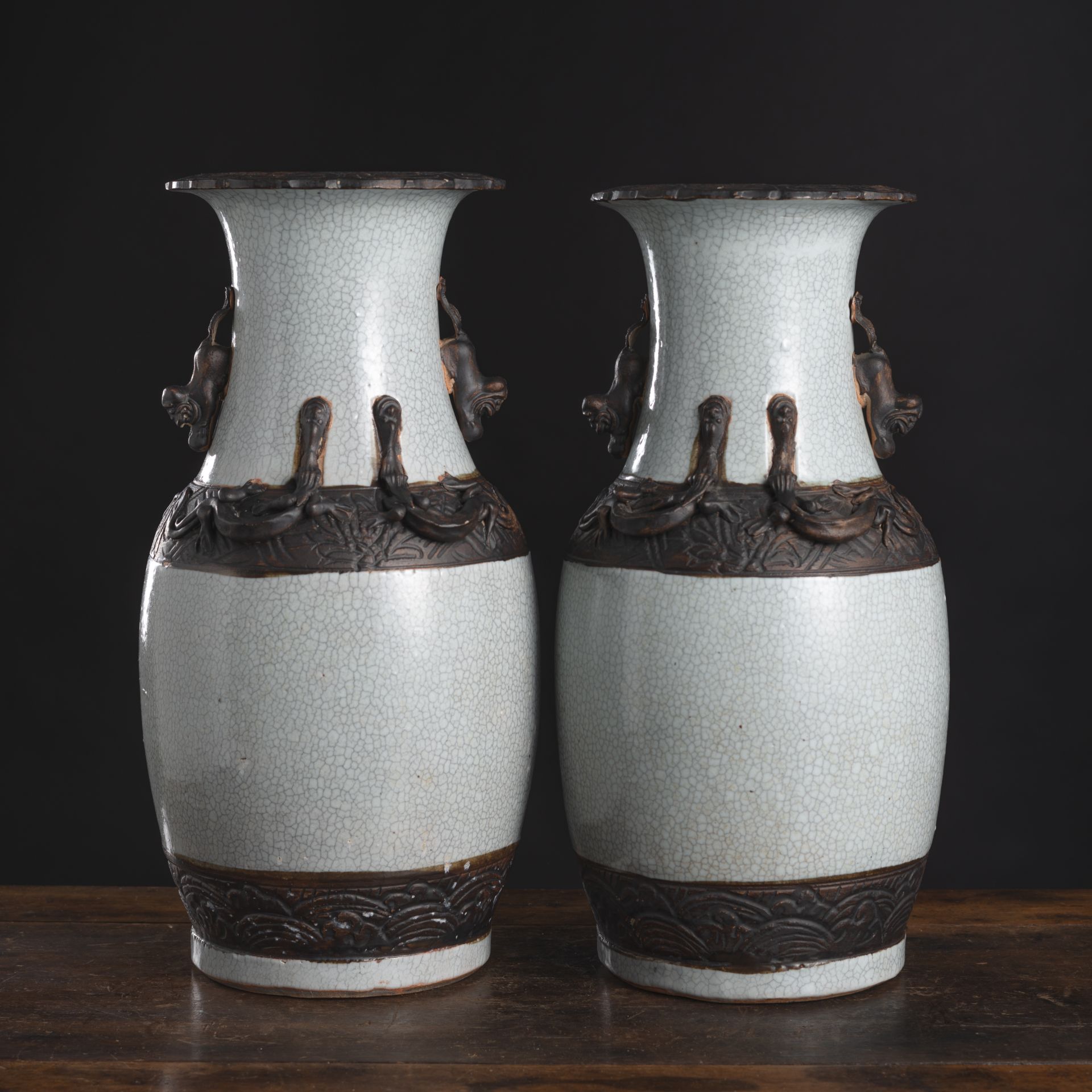 A PAIR OF RELIEF PORCELAIN VASES