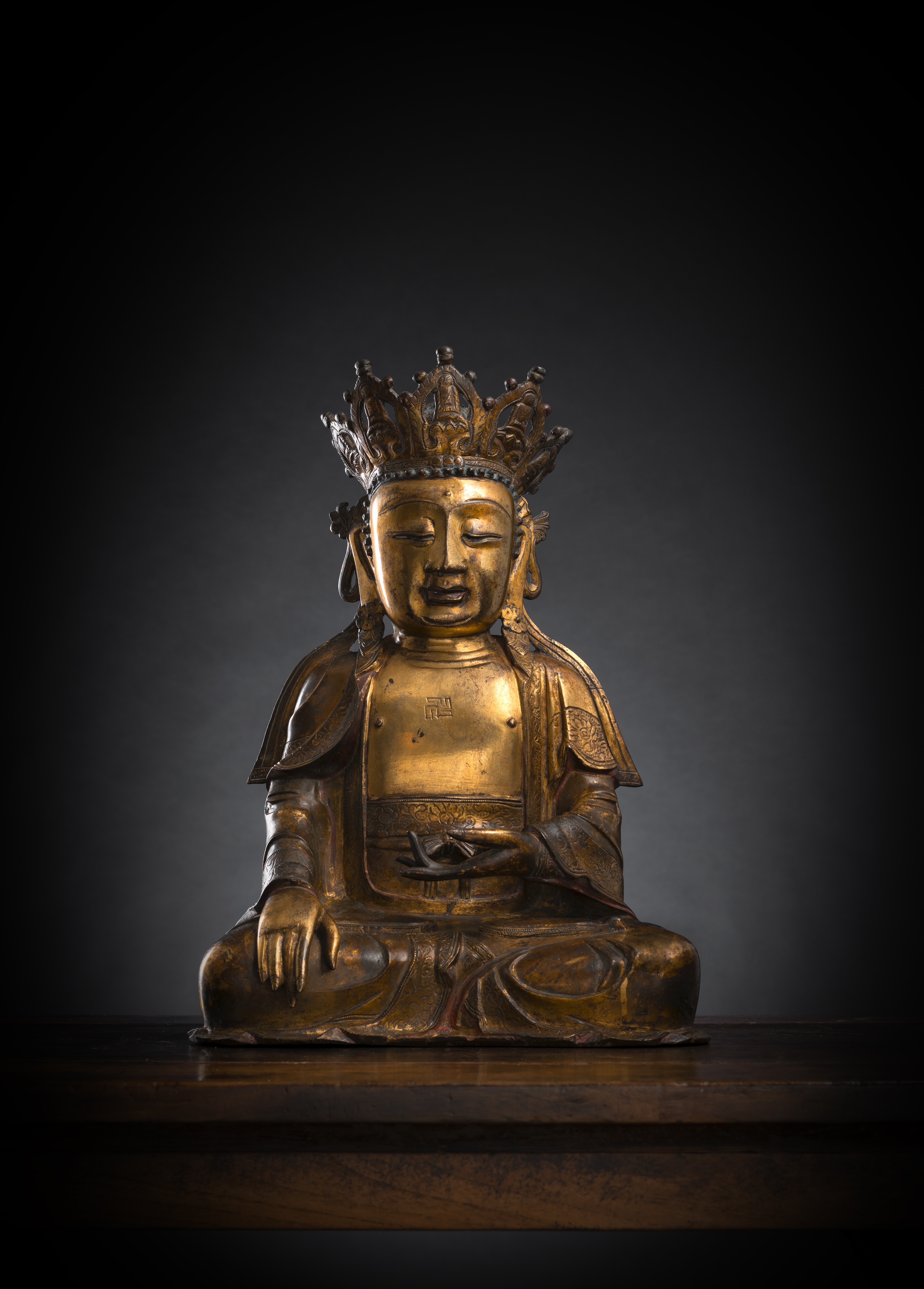 A GILT-BRONZE FIGURE OF THE BUDDHA PAREE