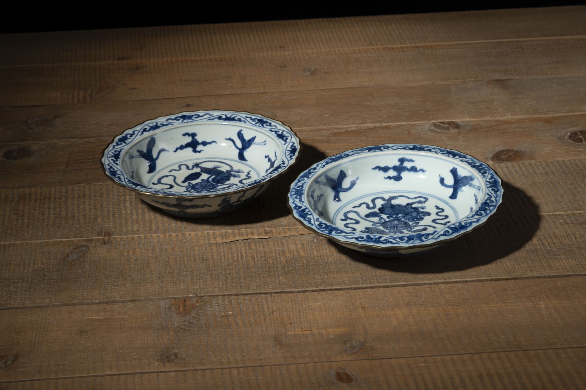 TWO FLORIFORM BLUE AND WHITE MYTHICAL CREATURE DISHES