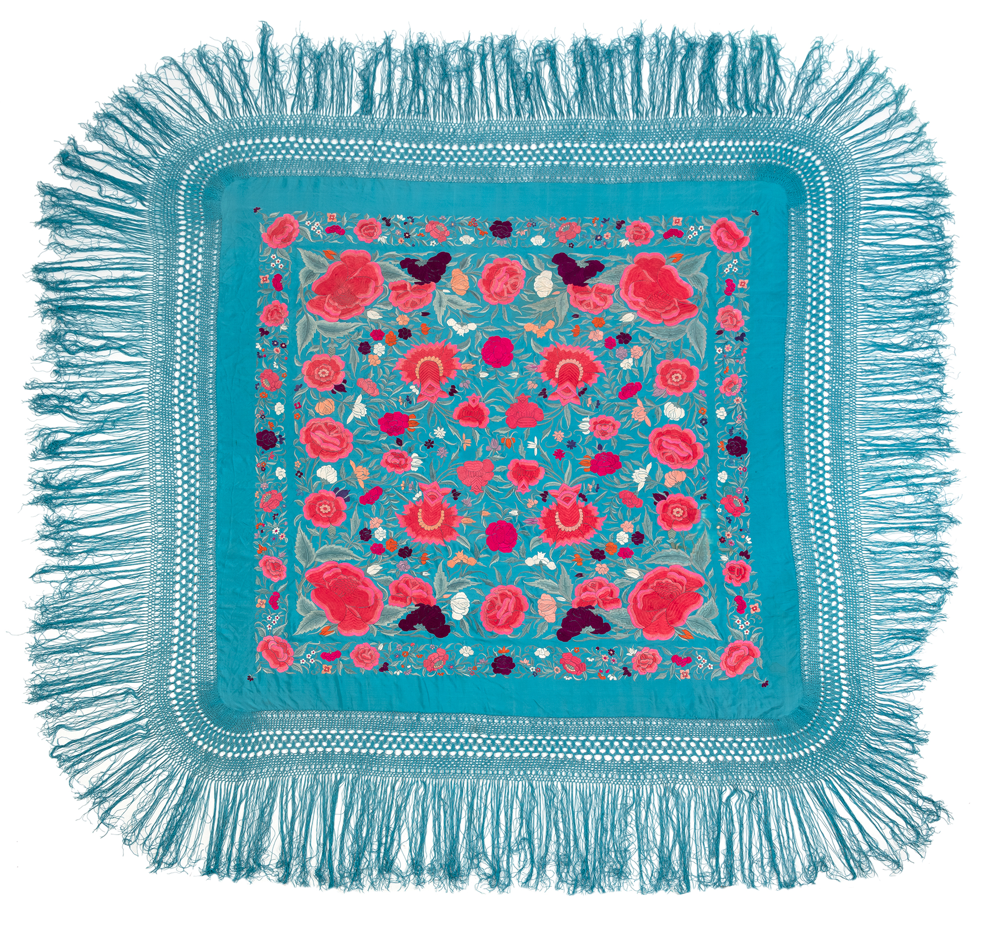 AN EMBROIDERED SILK COVER WITH PINK FLOWERS ON TURQUOISE SATIN AND KNOTTED FRINGES