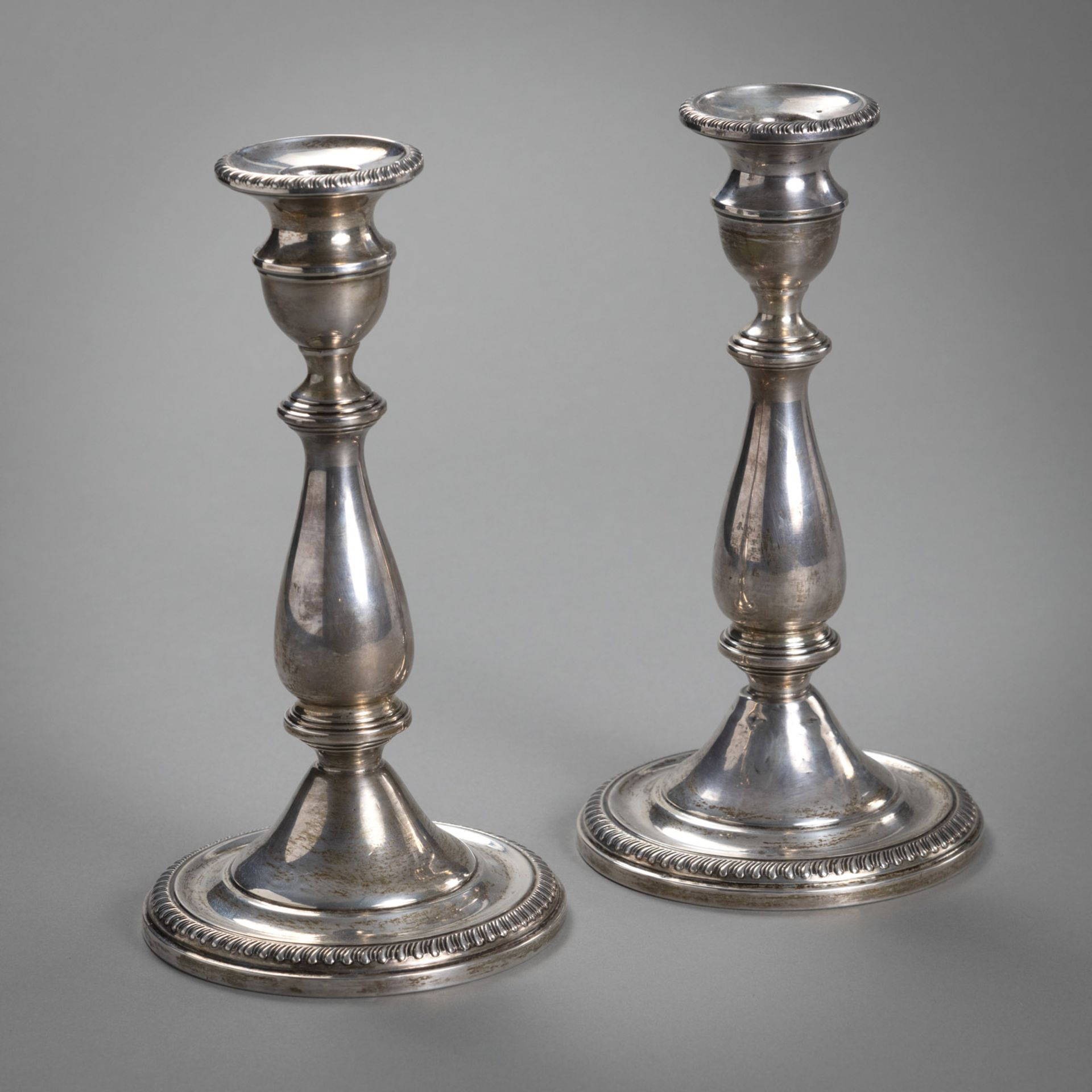 A PAIR OF STERLING SILVER CANDLESTICKS