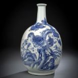 A BLUE AND WHITE BOTTLE VASE WITH A BIRD OF PREY