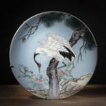 A LARGE POLYCHROME CRANE PORCELAIN CHARGER