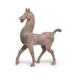 A FINE AND MASSIVE GREY POTTERY PRANCING HORSE