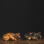 TWO IVORY AND DEER HORN NETSUKE OF LYING OXEN