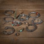 LOT OF JEWELRY: BANGLES, RINGS AND A NAIL PROTECTOR, PARTLY ENAMELLED AND WITH STONE INLAYS