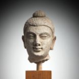 A STUCCO HEAD OF BUDDHA SHAKYAMUNI