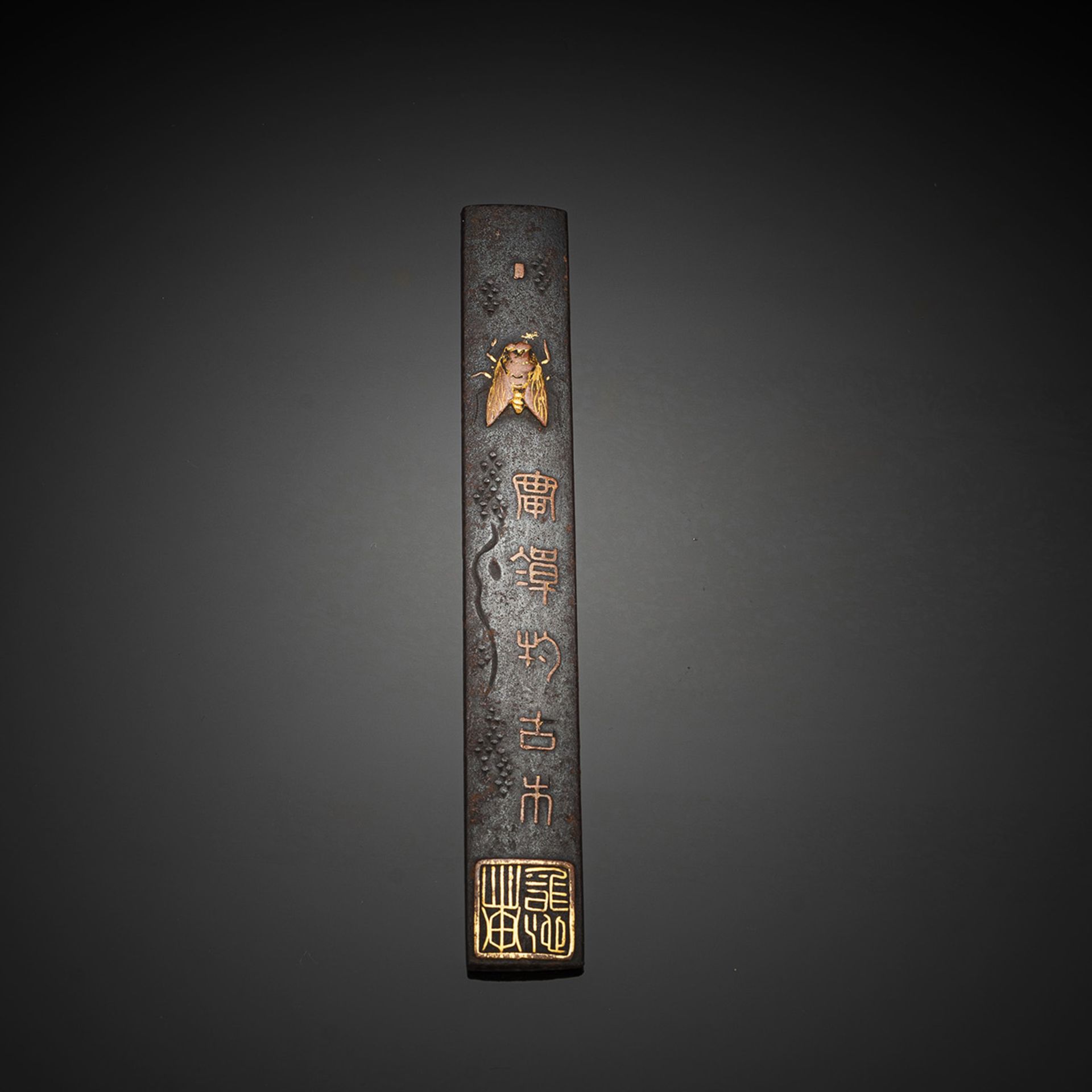 AN IRON KOZUKA WITH FLY, INSCRIPTION AND SEAL