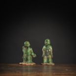 TWO GREEN-GLAZED POTTERY FIGURES OF SEATED LOUHAN