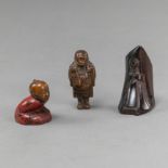 A GROUP OF THREE CARVED WOODEN NETSUKE PARTLY PAINTED