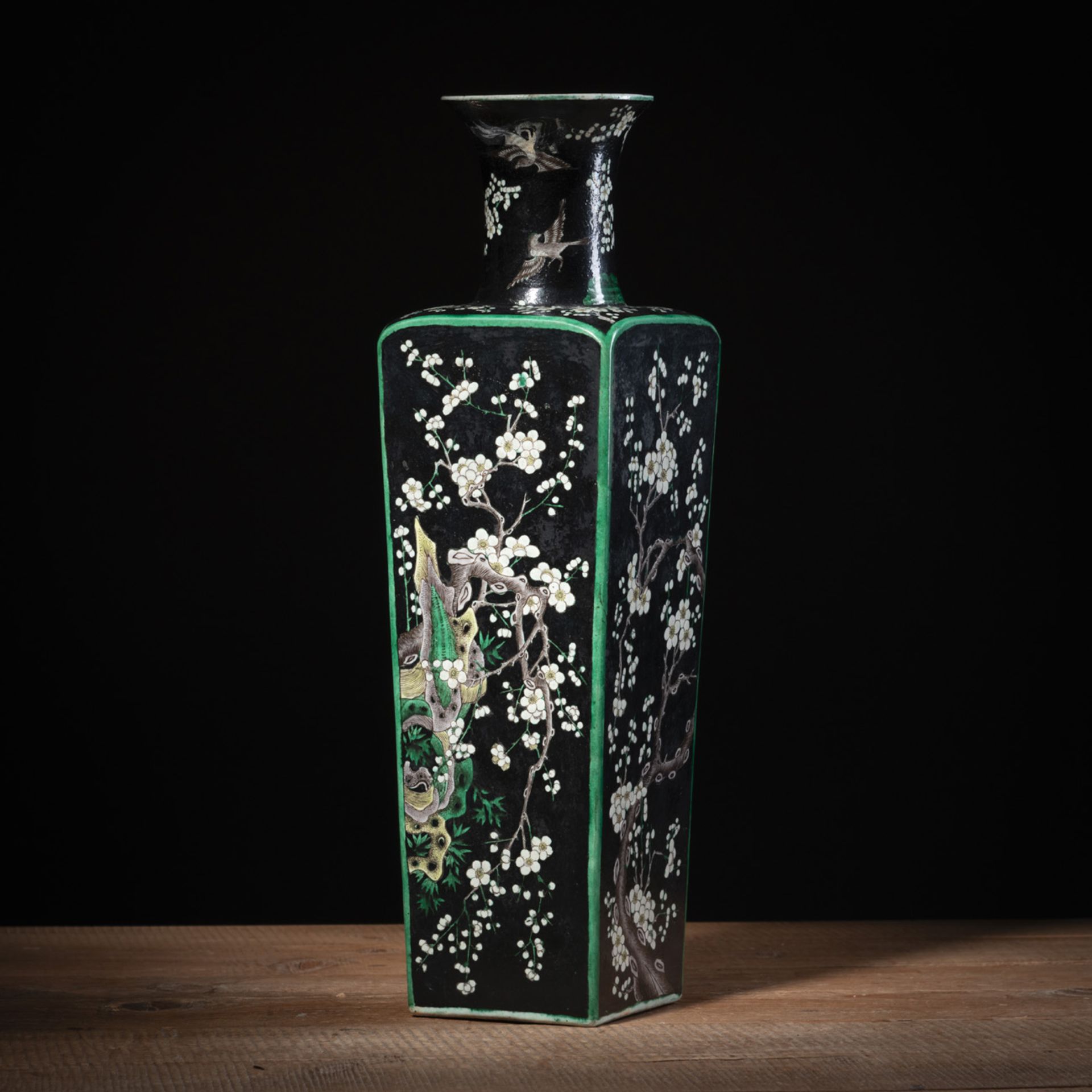 A SQUARE FAMILLE NOIRE PORCELAIN VASE WITH FLOWERING PRUNUS TREES ON ROCKS