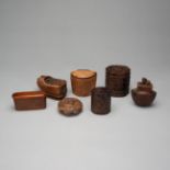 A GROUP OF SEVEN CARVED WOOD OPIUM BOXES