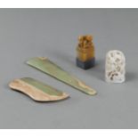 TWO ARCHAIC JADE OBJECTS, A PIERCED WHITE JADE FINIAL AND A SOAPSTONE SEAL TOPPED WITH TWO LIONS