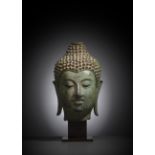 A FINE CAST BRONZE HEAD OF BUDDHA SHAKYAMUNI