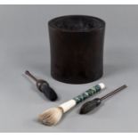 A HARDWOOD BRUSHPOT WITH THREE BRUSHES