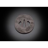 AN IRON TSUBA WITH FIGURAL DECORATION IN LANDSCAPE SCENES