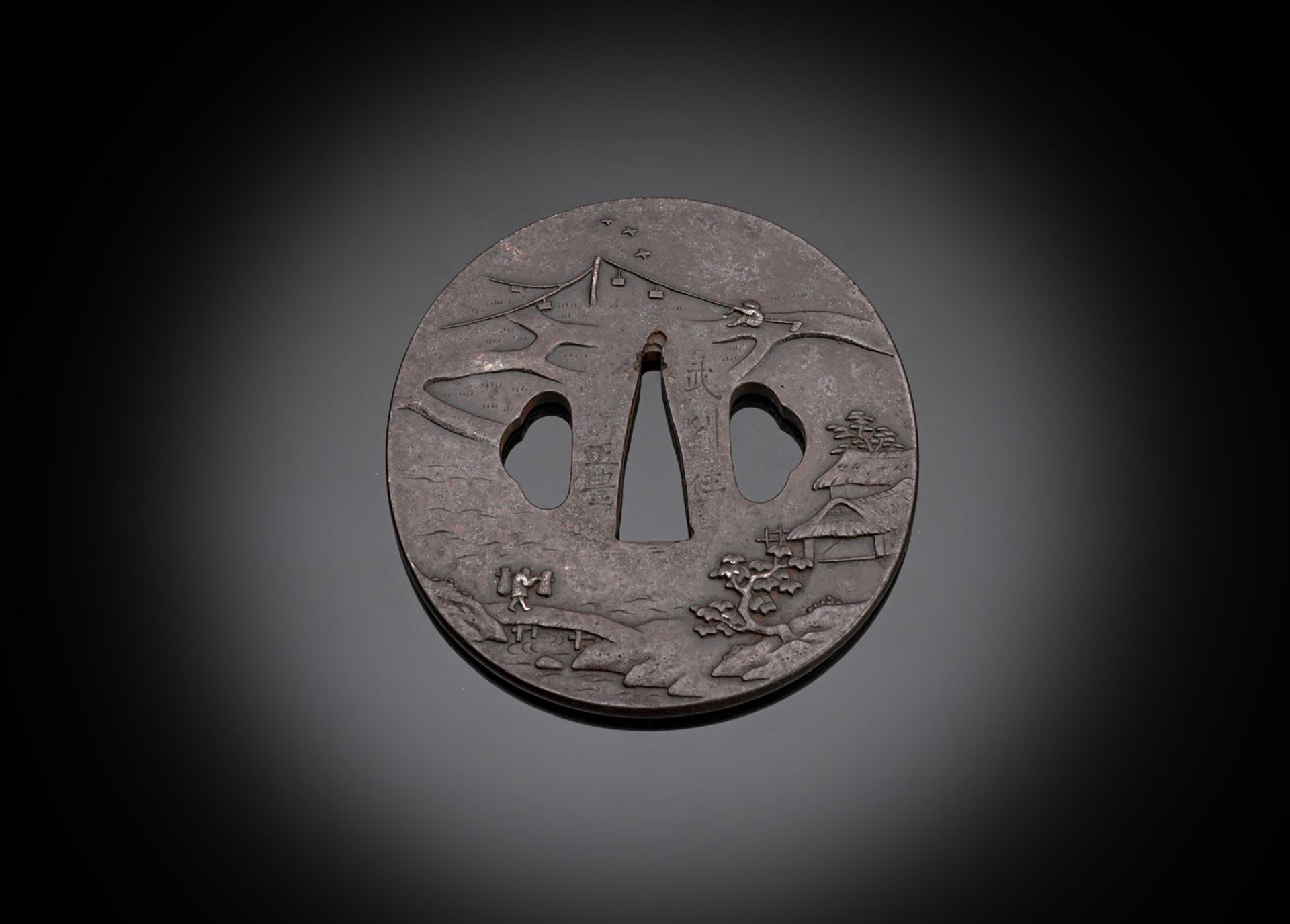 AN IRON TSUBA WITH FIGURAL DECORATION IN LANDSCAPE SCENES