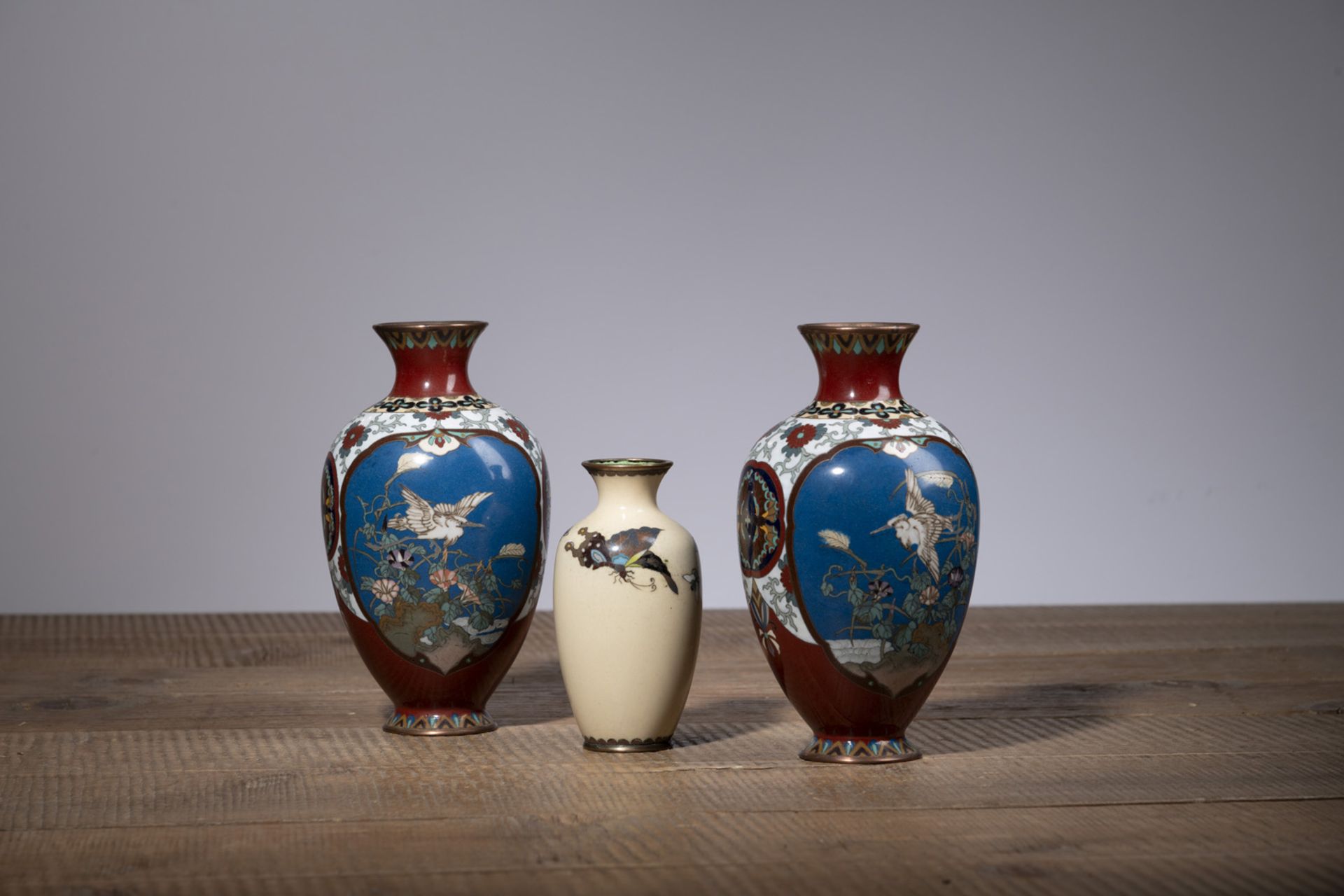 A PAIR OF FLORAL CLOISONNÉ-ENAMEL VASES AND A SMALLER VASE WITH BUTTERFLIES - Image 2 of 4