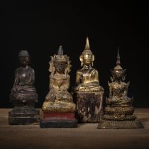 Vier Skulpturen des sitzenden Buddha aus Bronze und Holz