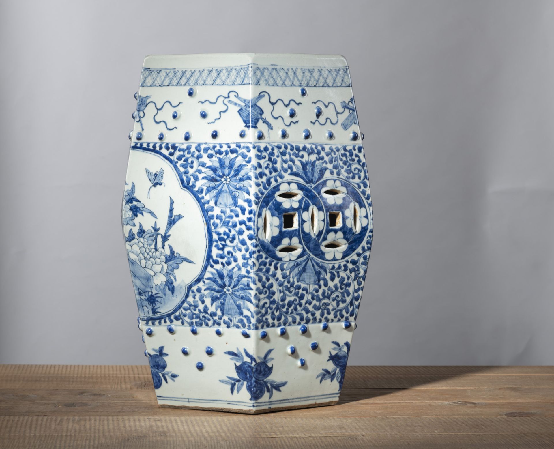 A HEXAGONAL BLUE AND WHITE PORCELAIN GARDEN STOOL WITH CASH COINS, FLOWERS AND LUCKY SYMBOLS DECORA - Image 2 of 4