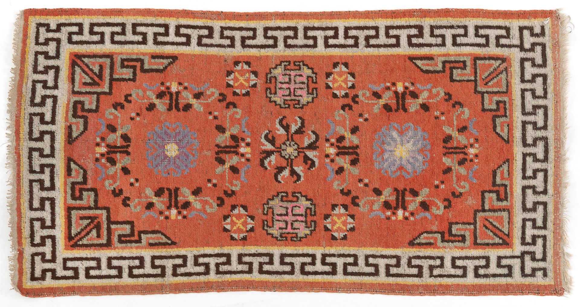 A SMALL CARPET WITH TWO MEDALLIONS