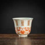 AN IRON-RED LOTUS AND 'SHOU' PORCELAIN CUP