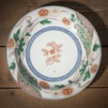 A POLYCHROME FLORAL AND POMEGRANATE PORCELAIN DISH