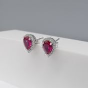 Pair of sterling silver ear studs set red and white stone halos