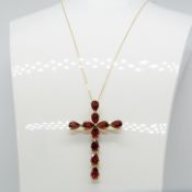 A 5.00 carat garnet-set cross pendant and chain in 18ct yellow gold