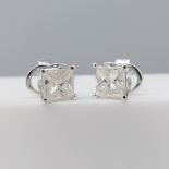 Pair of 18ct white gold princess-cut 1.06 carat diamond solitaire stud earrings