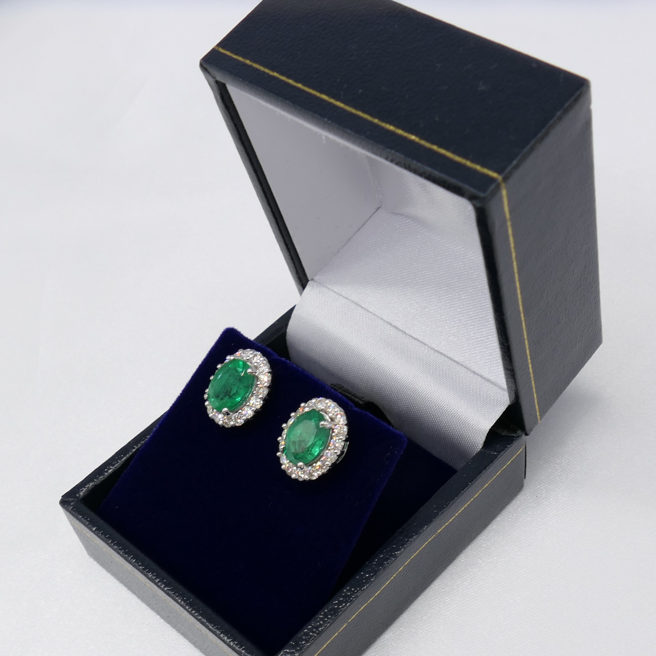 Pair of 18ct white gold oval emerald and diamond cluster ear studs, boxed - Image 3 of 7