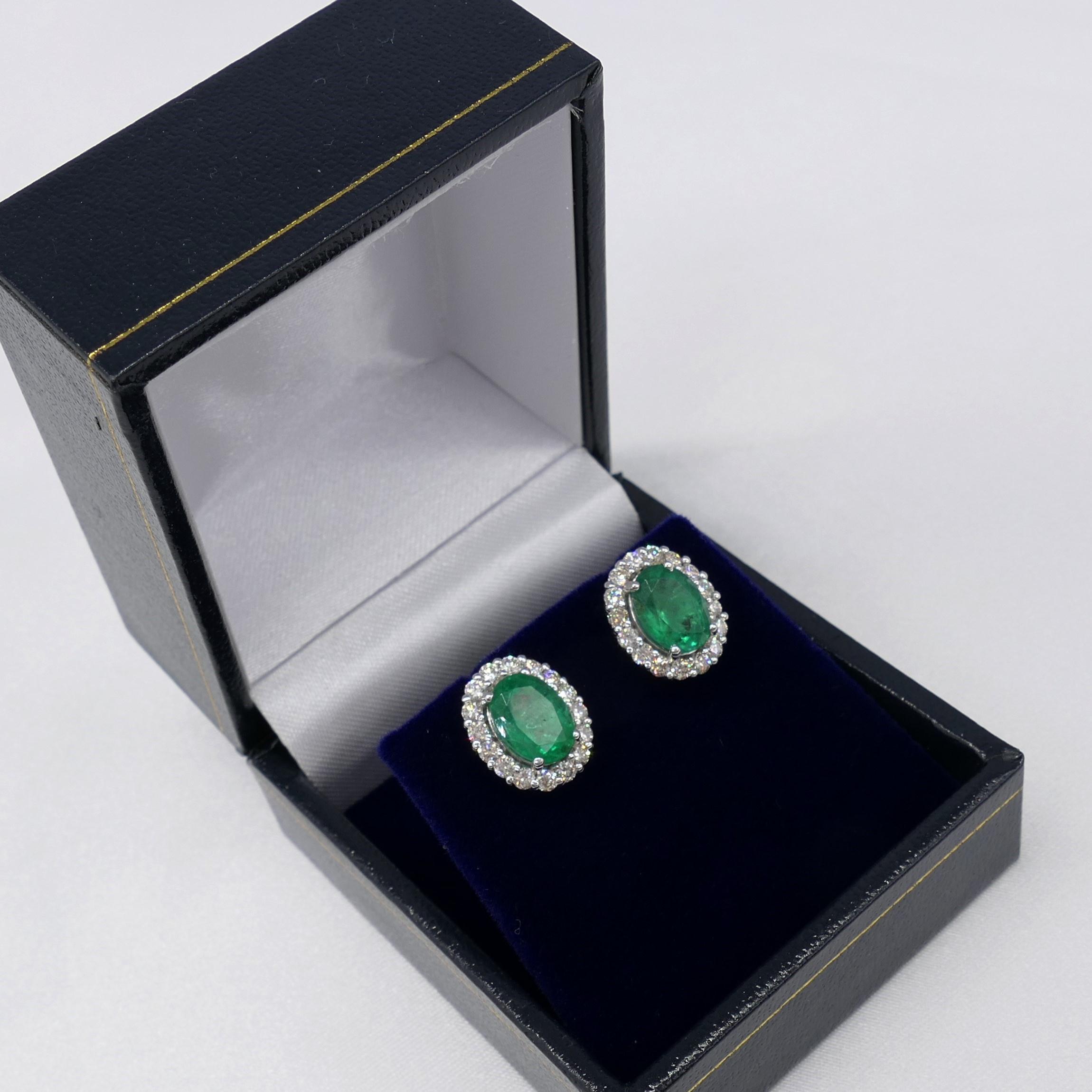 Pair of 18ct white gold oval emerald and diamond cluster ear studs, boxed - Image 7 of 7