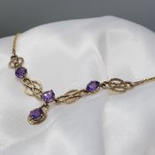 Ornate vintage 9ct yellow gold necklace set with round-cut purple amethysts